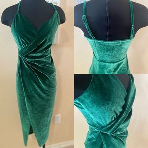 Emerald green velvet midi length dress with side split